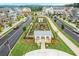 Aerial view of the community garden, walking trails and newly constructed homes within the Primary planned community at 3003 Clayton St, Woodstock, GA 30188