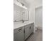 Stylish bathroom featuring sleek vanity, modern lighting, and subway tile shower at 3003 Clayton St, Woodstock, GA 30188