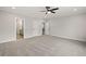 Spacious carpeted bedroom featuring a modern ceiling fan and ample natural light at 3003 Clayton St, Woodstock, GA 30188