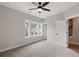 Bright bedroom with plush carpeting, large windows, and ample closet space at 3003 Clayton St, Woodstock, GA 30188