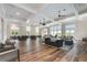 Spacious clubhouse lounge area with seating, tables, and large windows at 3003 Clayton St, Woodstock, GA 30188