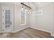 The bright dining room features hardwood floors and a stylish lighting fixture at 3003 Clayton St, Woodstock, GA 30188
