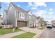 Exterior shot of a two-story house, complete with a landscaped lawn, a wide driveway and inviting curb appeal at 3003 Clayton St, Woodstock, GA 30188