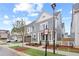 A two-story home boasting a well-kept lawn and beautifully landscaped surroundings, offering a picturesque view at 3003 Clayton St, Woodstock, GA 30188