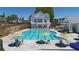 Community pool with poolside seating and umbrella tables, offering a relaxing retreat at 3003 Clayton St, Woodstock, GA 30188