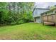 The beautiful backyard has a small wood deck that leads to the door to the basement at 3897 Mcgill Dr, Decatur, GA 30034
