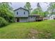 Expansive backyard featuring a deck and a door that leads to the basement at 3897 Mcgill Dr, Decatur, GA 30034
