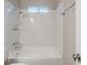 Bright bathroom featuring shower with plastic surround, and a toilet at 3897 Mcgill Dr, Decatur, GA 30034
