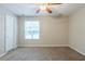 Bedroom featuring carpet floors, a ceiling fan, and a window with blinds at 3897 Mcgill Dr, Decatur, GA 30034