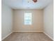 Neutral bedroom featuring carpet floors, a ceiling fan, and a window with blinds at 3897 Mcgill Dr, Decatur, GA 30034