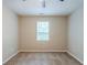 Neutral bedroom featuring carpet floors, a ceiling fan, and a window with blinds at 3897 Mcgill Dr, Decatur, GA 30034