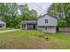 Charming split level home with stone facade and landscaped front yard at 3897 Mcgill Dr, Decatur, GA 30034