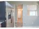 Hallway view into living room, with a stainless steel refrigerator and neutral paint at 3897 Mcgill Dr, Decatur, GA 30034