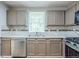 Updated kitchen with stainless steel dishwasher, neutral countertops, and ample storage at 3897 Mcgill Dr, Decatur, GA 30034