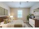 Staged main bedroom featuring decor, a window, and carpet flooring at 3897 Mcgill Dr, Decatur, GA 30034