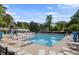 Inviting community pool with ample seating, umbrellas, and a diving board, surrounded by lush trees at 4628 Mountain Creek Ne Dr, Roswell, GA 30075