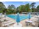 Expansive community pool featuring abundant seating, umbrellas, and well-maintained surroundings for residents to enjoy at 4628 Mountain Creek Ne Dr, Roswell, GA 30075