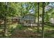 Charming two-story home with a brick facade, complemented by a spacious backyard and a wooden deck for relaxation at 4628 Mountain Creek Ne Dr, Roswell, GA 30075