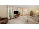 Bright living room with hardwood floors, and soft neutral colors with plenty of comfortable seating at 4628 Mountain Creek Ne Dr, Roswell, GA 30075