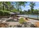 Relax on the tennis court patio, furnished with tables and benches, perfect for a leisurely break during the game at 4628 Mountain Creek Ne Dr, Roswell, GA 30075