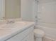 Bathroom featuring single sink vanity with white cabinets and a shower-tub combination at 494 Charleston Pl, Villa Rica, GA 30180