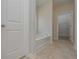 Bathroom featuring a soaking tub perfect for relaxation and a spa-like experience at 494 Charleston Pl, Villa Rica, GA 30180
