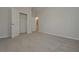 Bedroom featuring neutral walls, carpet flooring, and an attached bathroom and closet at 494 Charleston Pl, Villa Rica, GA 30180