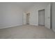 Bedroom featuring neutral walls, carpet flooring, and an attached closet and bathroom at 494 Charleston Pl, Villa Rica, GA 30180