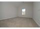 Bedroom featuring neutral walls, carpet flooring, and a window letting in natural light at 494 Charleston Pl, Villa Rica, GA 30180