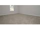 Bedroom filled with natural light, neutral walls, and carpeted flooring at 494 Charleston Pl, Villa Rica, GA 30180