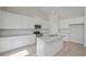Modern kitchen featuring stainless steel appliances, granite countertops, and ample white cabinetry at 494 Charleston Pl, Villa Rica, GA 30180