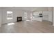 Open-concept living room with fireplace flows into a modern kitchen, perfect for entertaining and everyday living at 494 Charleston Pl, Villa Rica, GA 30180
