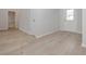 Bright living space boasts modern wood-look floors and neutral paint, creating a versatile atmosphere at 494 Charleston Pl, Villa Rica, GA 30180