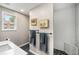 Bright bathroom features a walk-in shower with white subway tile and upgraded fixtures at 67 Lannon Ne Ave, Atlanta, GA 30317