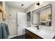 Modern bathroom featuring a stylish vanity, framed mirror, and modern fixtures at 67 Lannon Ne Ave, Atlanta, GA 30317