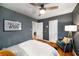 Comfortable bedroom features stylish wall decor and an accent chair at 67 Lannon Ne Ave, Atlanta, GA 30317