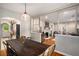 Open dining area with dark wood table adjacent to cozy living room with fireplace at 67 Lannon Ne Ave, Atlanta, GA 30317