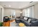 Bright living room featuring hardwood floors, stylish furniture, and a large sectional sofa at 67 Lannon Ne Ave, Atlanta, GA 30317