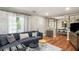 Cozy living room showcases hardwood floors, modern furniture, and lots of natural light at 67 Lannon Ne Ave, Atlanta, GA 30317