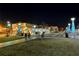 Nighttime view of the town square featuring decorative light posts and open space at 67 Lannon Ne Ave, Atlanta, GA 30317