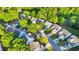 An aerial view of the home and surrounding neighborhood showcases its charming curb appeal and lush greenery at 335 Pintail Ct, Suwanee, GA 30024