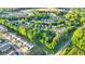The aerial view shows the property nestled within a lush, green neighborhood at 335 Pintail Ct, Suwanee, GA 30024