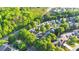 Aerial shot showing the neighborhood's layout and tree-lined streets at 335 Pintail Ct, Suwanee, GA 30024