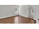 Bright bedroom with hardwood floors and plenty of natural light from the window at 335 Pintail Ct, Suwanee, GA 30024