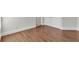Bedroom showcasing hardwood floors leading to a closet with white doors at 335 Pintail Ct, Suwanee, GA 30024