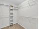 Walk-in closet with shelving and ample hanging space at 335 Pintail Ct, Suwanee, GA 30024