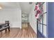 Inviting entryway featuring hardwood floors, neutral walls, and views into the living spaces at 335 Pintail Ct, Suwanee, GA 30024