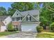 Charming two-story home with a well-manicured lawn and a two-car garage at 335 Pintail Ct, Suwanee, GA 30024