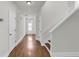 Bright hallway with hardwood floors leading to the main living areas and stairs at 335 Pintail Ct, Suwanee, GA 30024