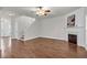 Spacious living room with hardwood floors, a fireplace, and staircase at 335 Pintail Ct, Suwanee, GA 30024